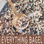Everything Bagel Seasoning mixed on gray plate with small gold spoon overhead view - brown rectangle with white text overlay