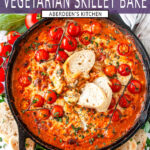 Cheesy White Bean Skillet Bake with sliced baguette and cherry tomatoes in lodge cast iron skillet on white marble - purple rectangle overlay with white text