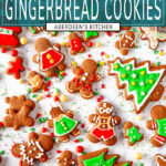 Gingerbread Cookies with red, green, and white icing topped with holiday sprinkles on white marble - green rectangle with white text overlay