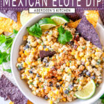 Elote dip in white bowl with purple and yellow tortilla chips overhead view