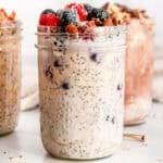 Easy overnight oats with mixed berries, almonds, and chia seeds in a mason jar