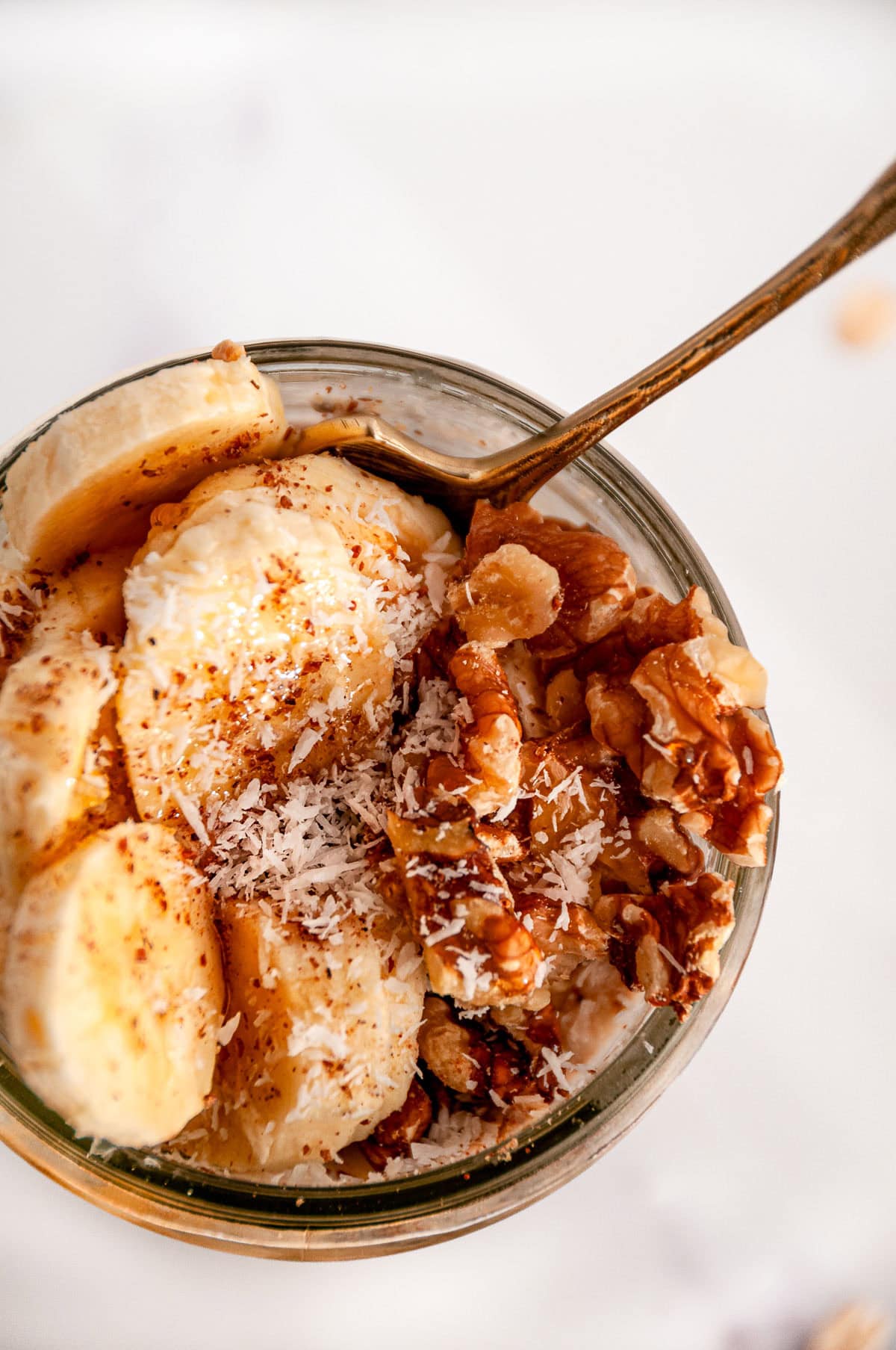 Banana bread overnight oats topped with walnuts and coconut